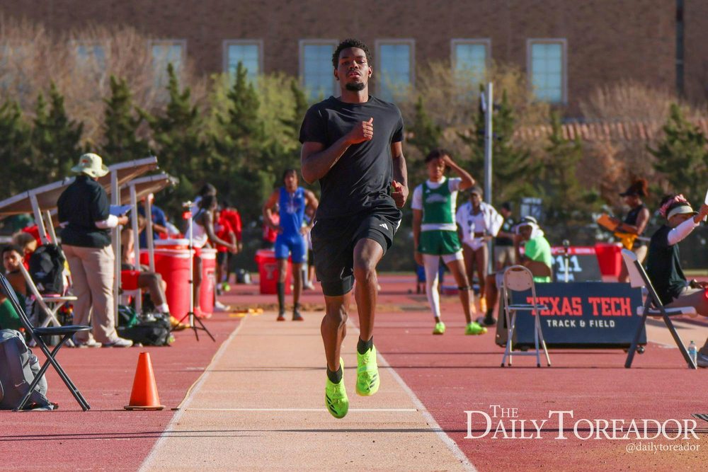Texas Tech jumper on the runway at a track meet